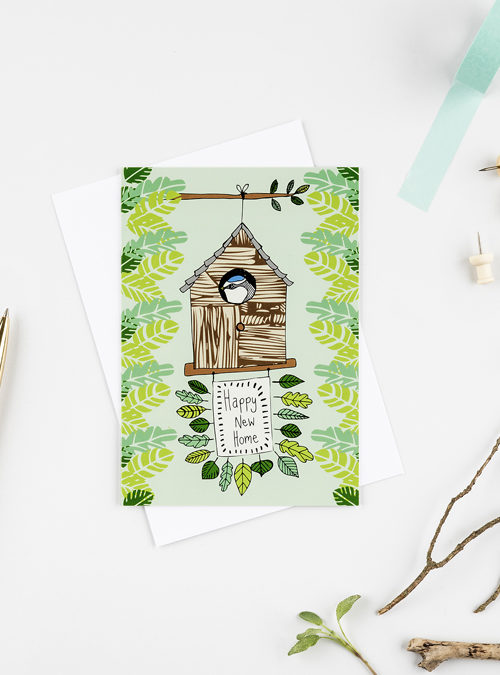 Happy new home card featuring an illustration of a bird in their bird house