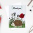 Hedgehog card featuring an illustration of a hedgehog with british flowers in the background and the text 'Thank you' above