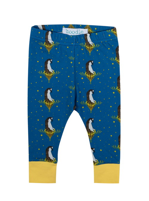 Blue baby leggings featuring a repeat pattern of an otter in kelp. Elasticated organic cotton with yellow organic cuffs