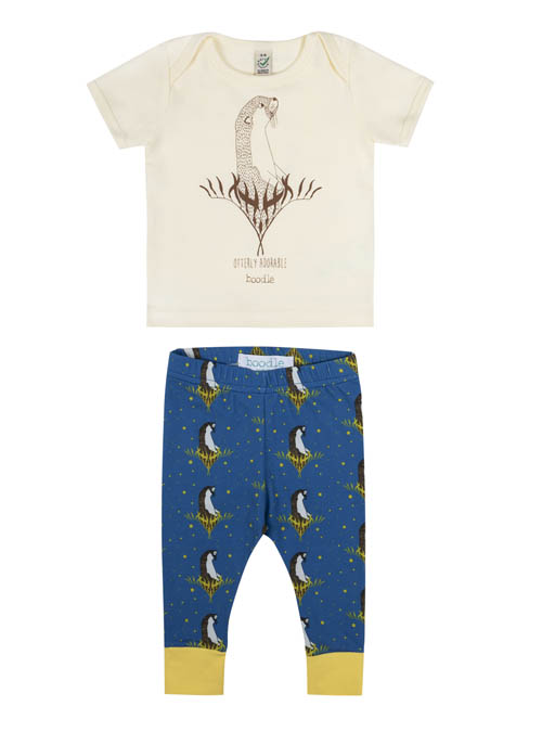 Otter baby outfit featuring an illustration of an otter on natural white organic cotton. Paired with blue leggings featuring a repeat pattern of an otter and kelp with yellow cuffs.