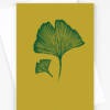 Ginko card featuring 2 Ginko leaves on a mustard background